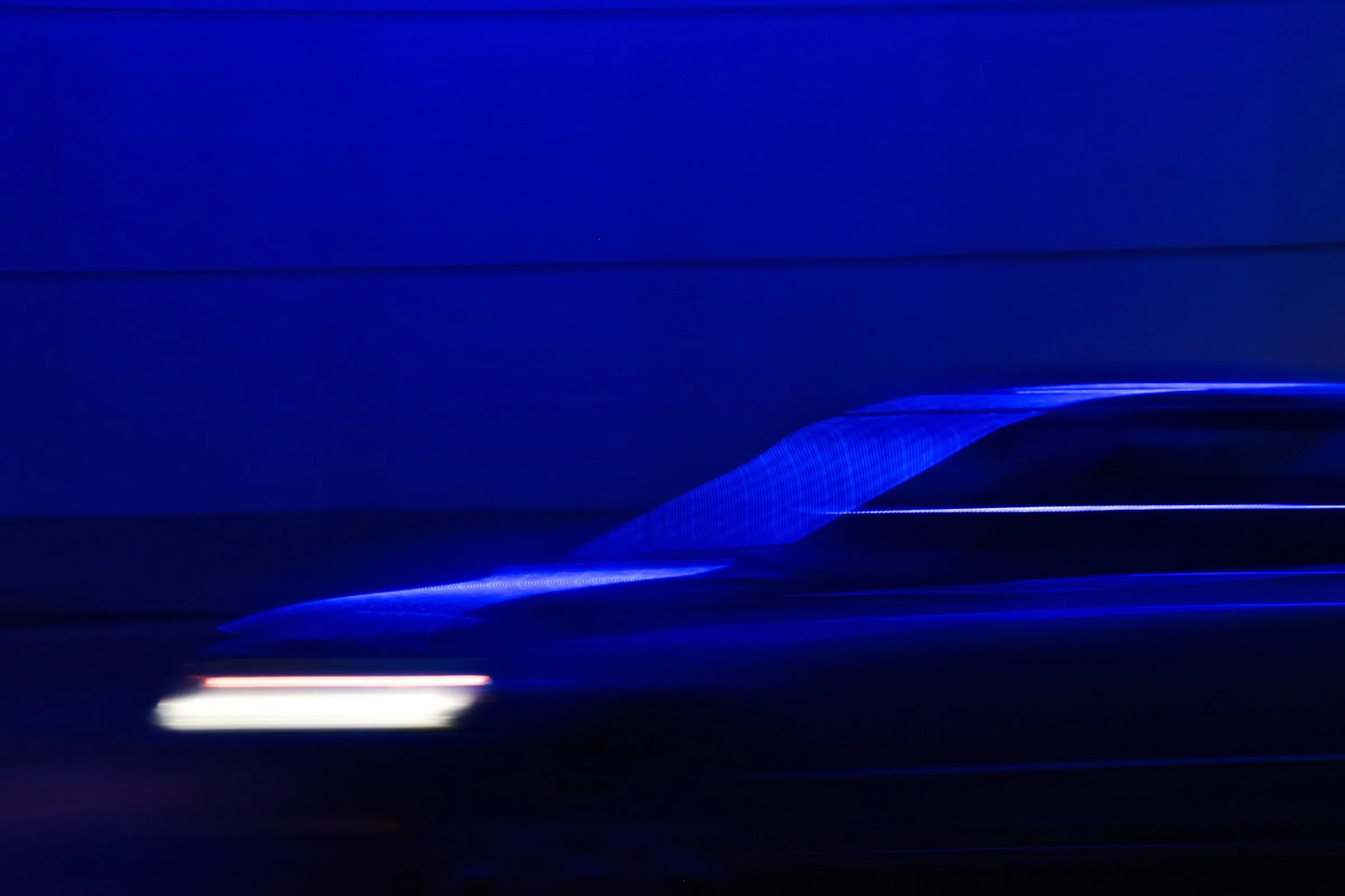 Blue light moving through a dark environment